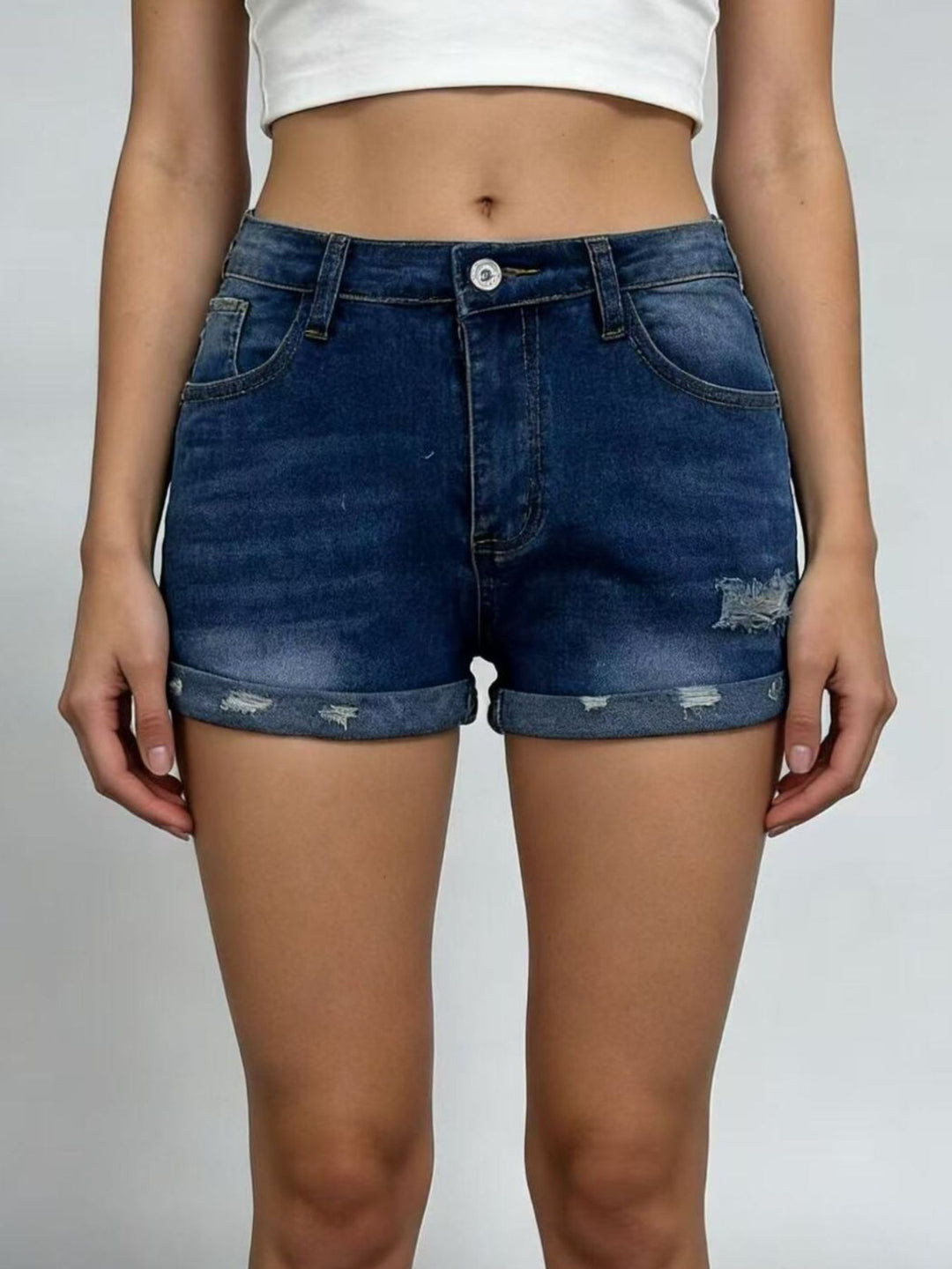 Distressed roll-up denim shorts with cuffed hem