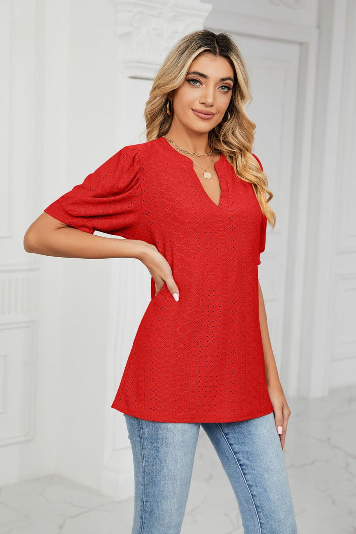 Eyelet puff sleeve top with notched V-neck