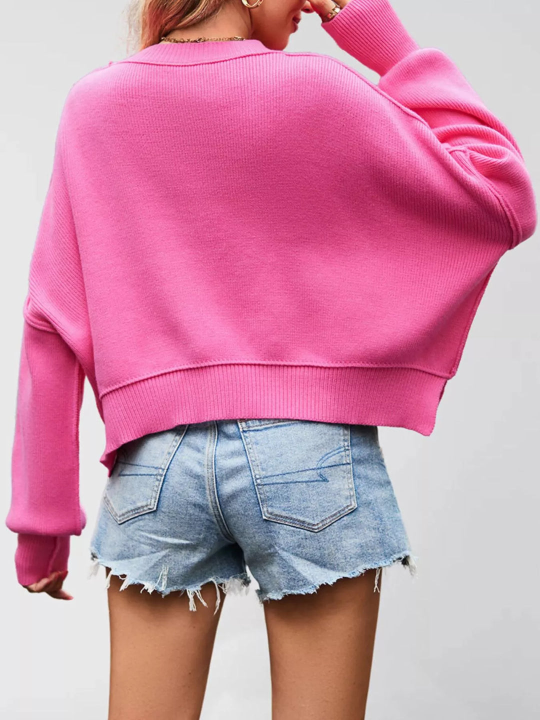 Dropped shoulder crew neck sweater with ribbed raw hem