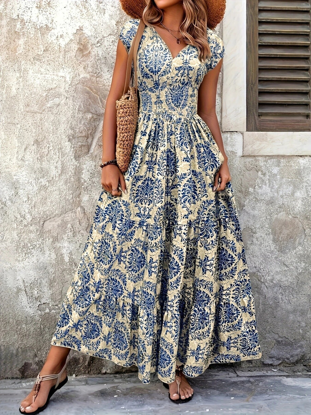 Smocked tiered maxi dress with cap sleeves and side slit