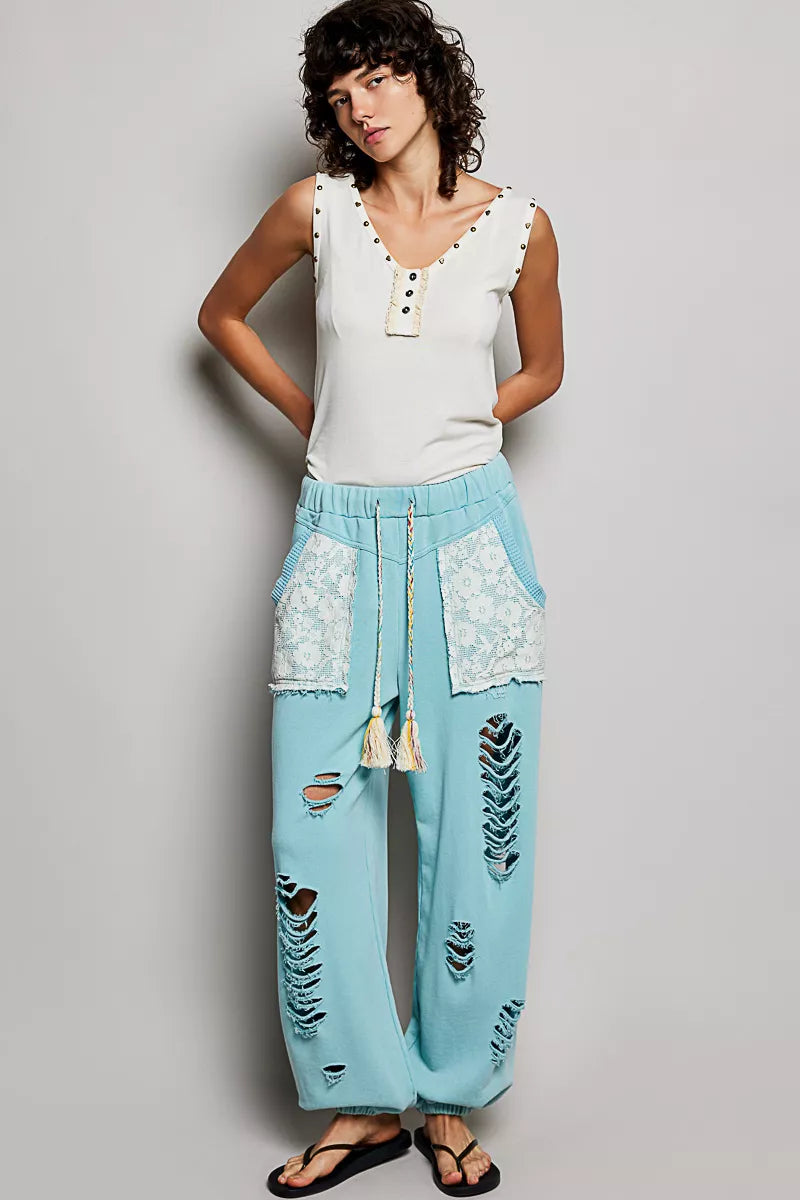 Studded V-neck sleeveless knit tank with button-front ruffle