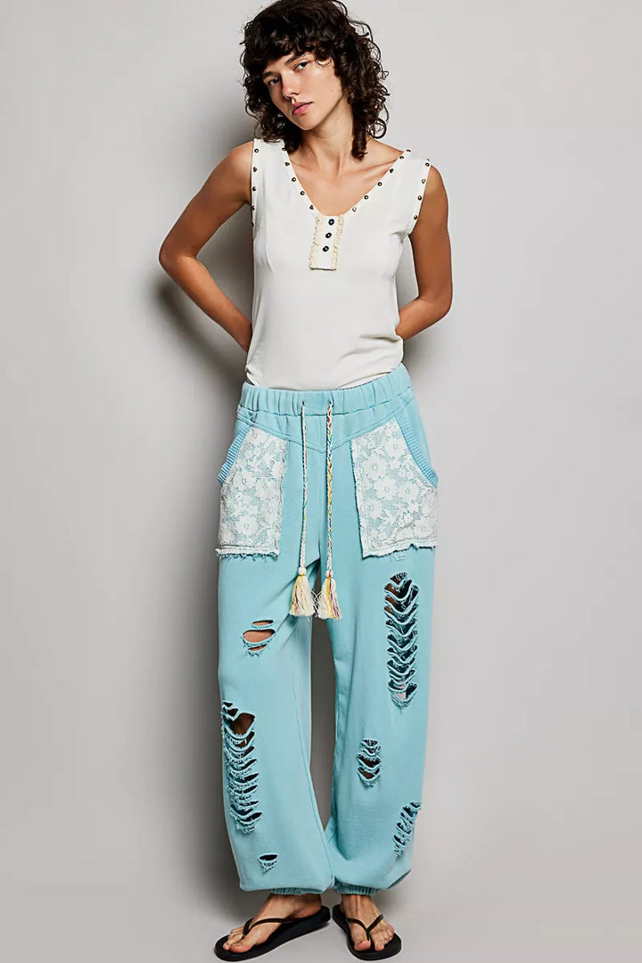 Studded V-neck sleeveless knit tank with button-front ruffle