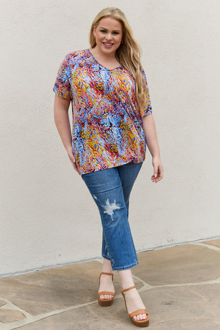 Abstract print dolman sleeve flowy V-neck top