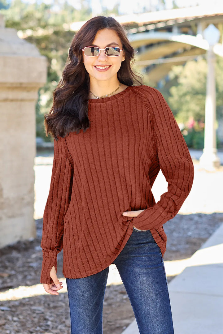 Ribbed knit round neck long sleeve top with curved hem