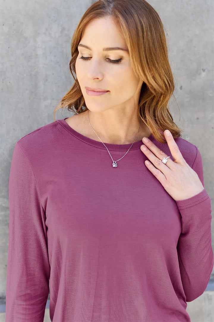 Crew neck long sleeve top with curved hem