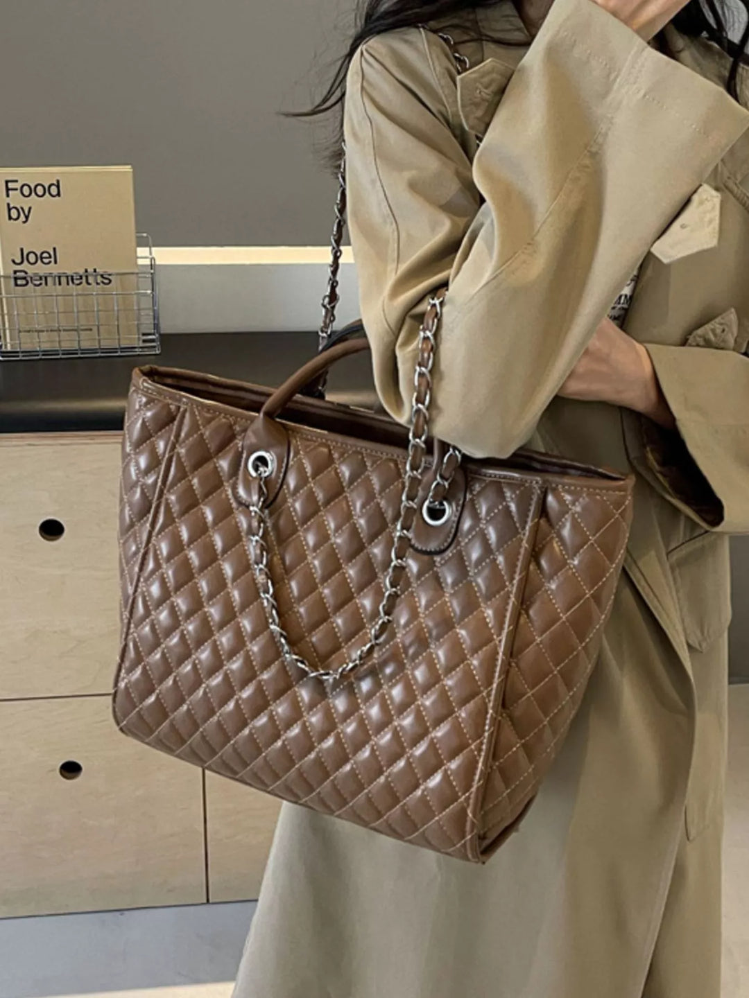 Diamond quilted faux leather tote bag with chain straps