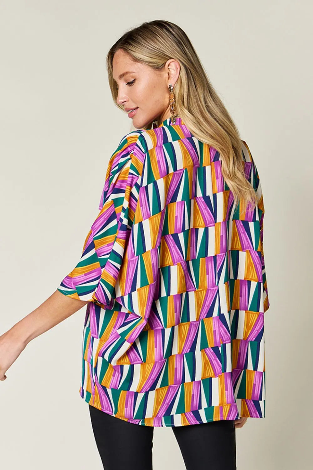 Geometric print notched neck dolman sleeve top