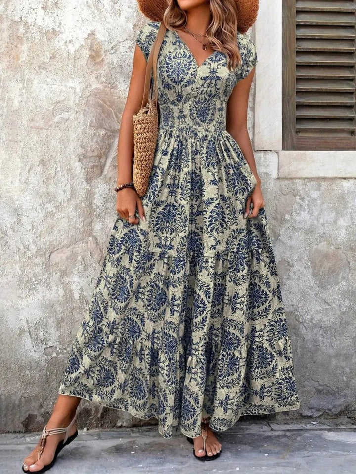 Smocked tiered maxi dress with cap sleeves and side slit