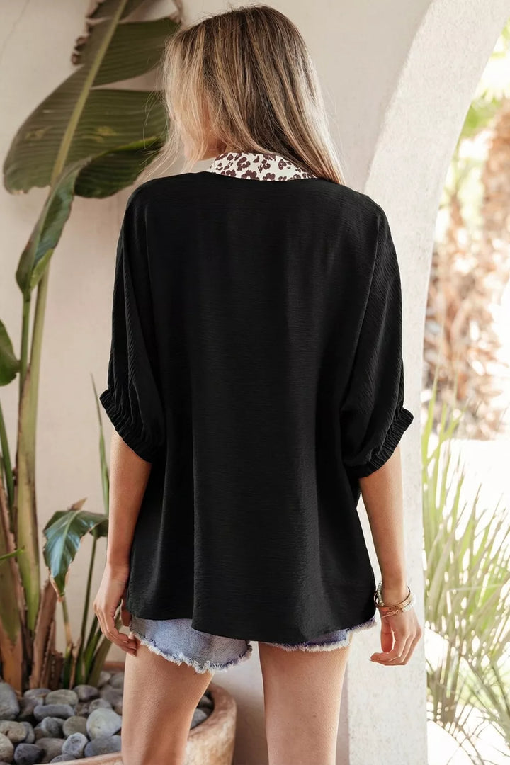 Plus size notched V-neck top with leopard collar trim