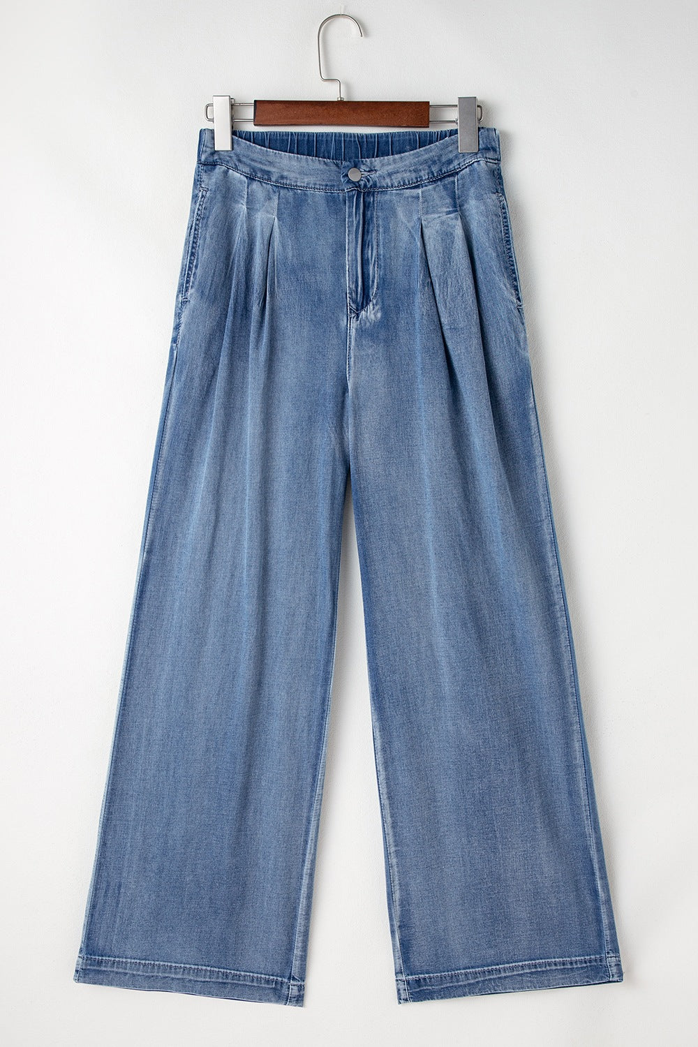 Pleated high-rise wide-leg jeans with deep pockets