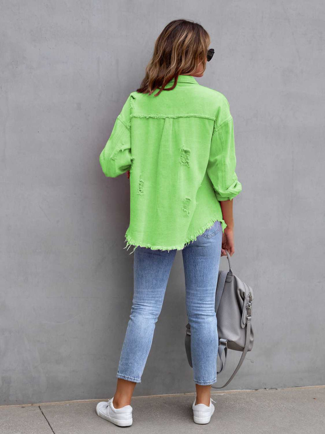 Distressed drop shoulder denim jacket with fringe hem