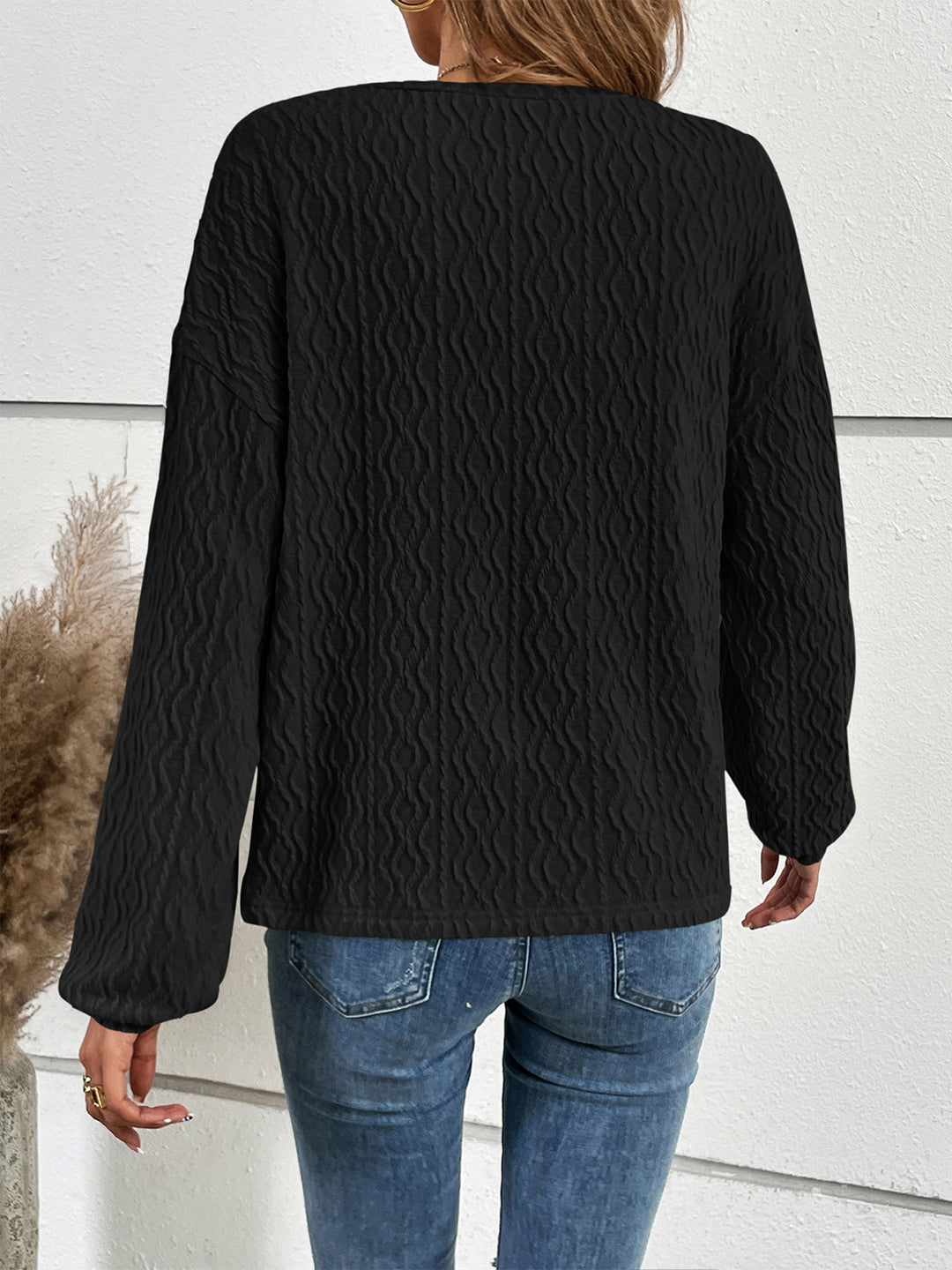 Textured half-button henley top with long sleeves
