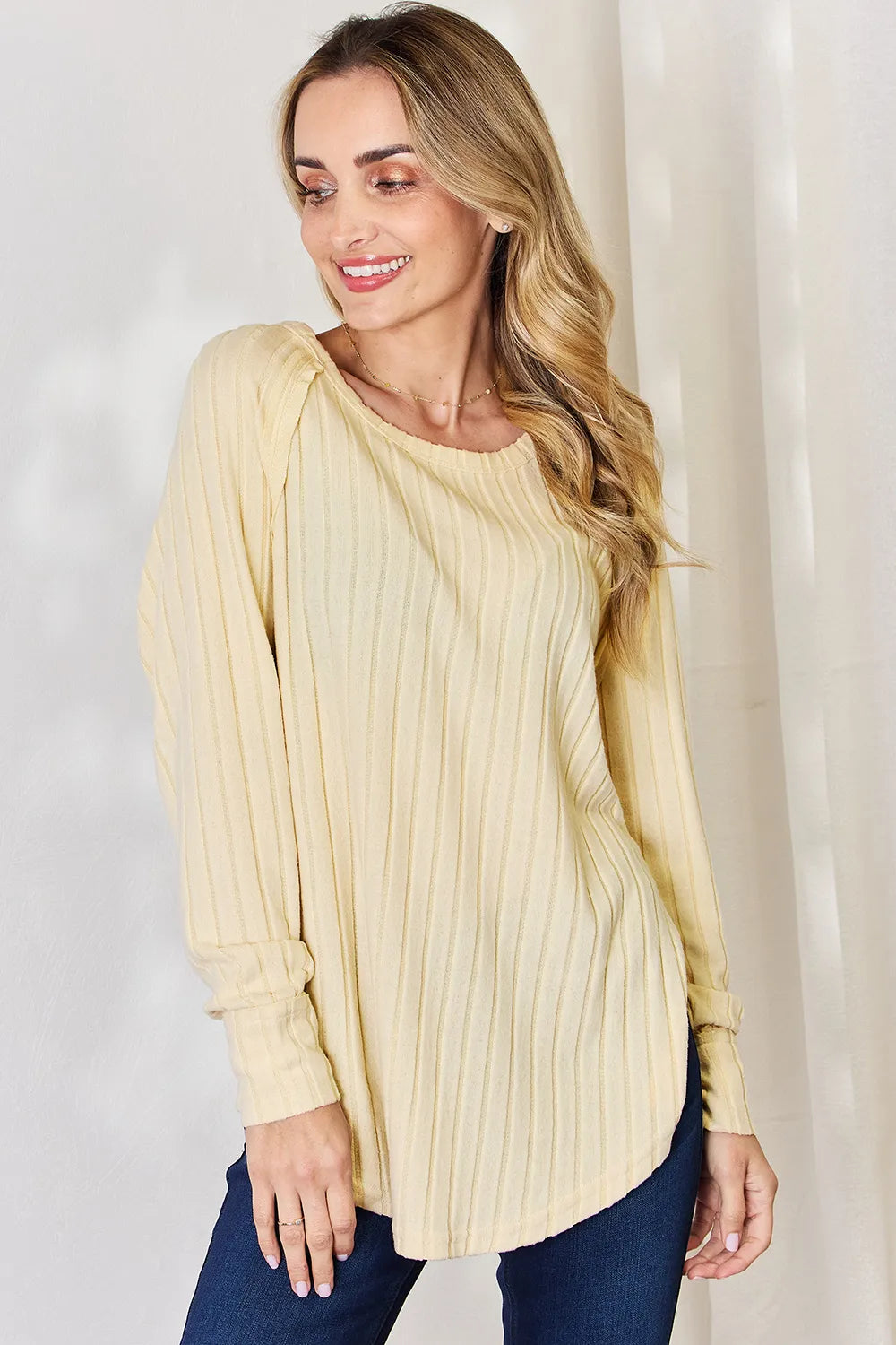 Ribbed knit round neck long sleeve top with side slits