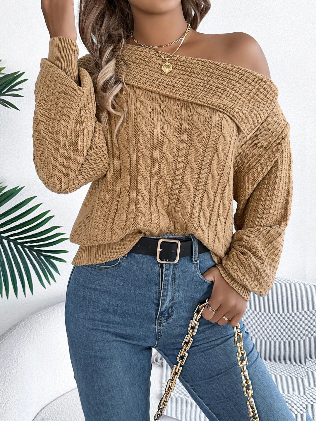 Cable knit one-shoulder sweater with fold-over ribbed collar