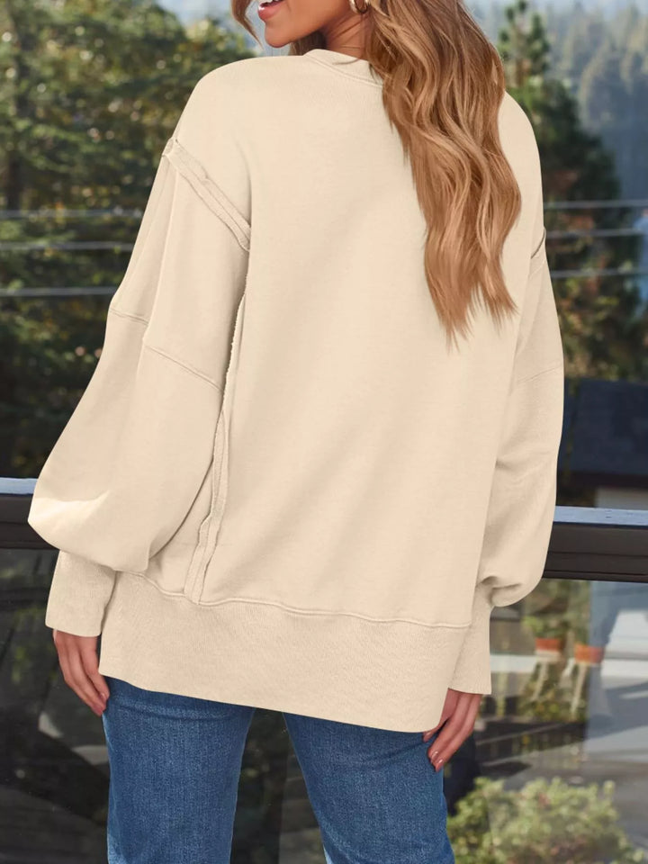 Oversized side-slit sweatshirt with exposed seams
