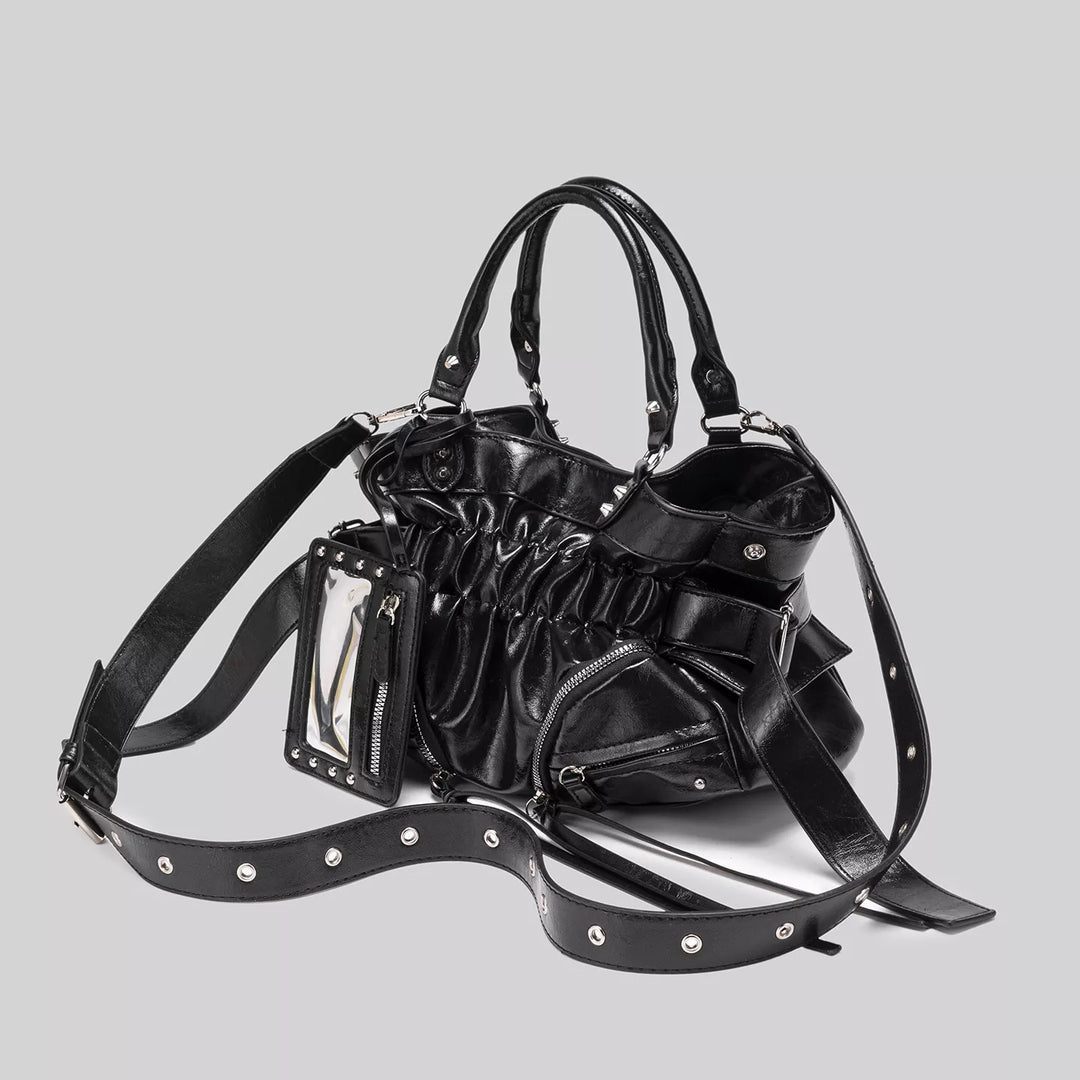 Ruched faux leather crossbody bag with studded mirror charm