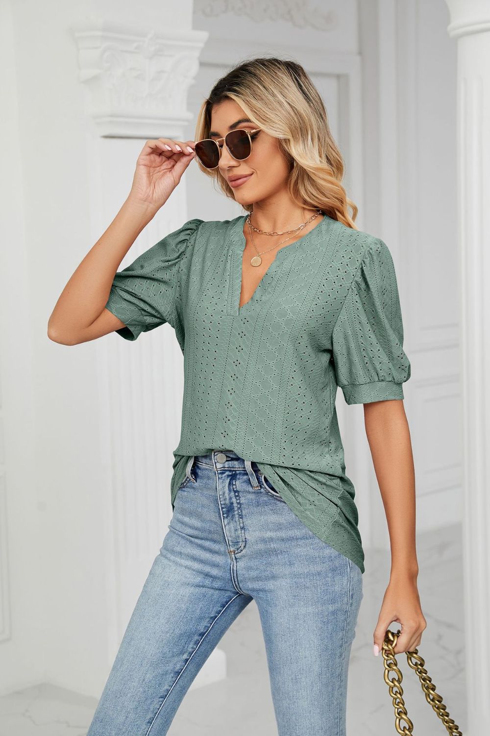 Eyelet puff sleeve top with notched V-neck