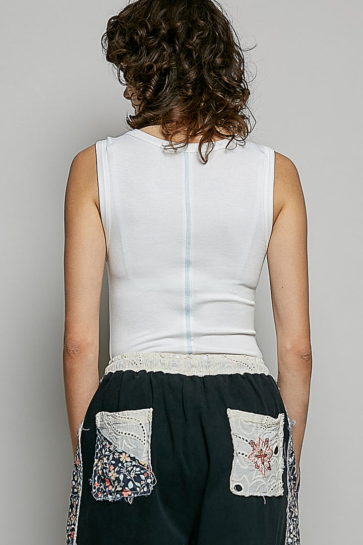 Ribbed knit tank with colorful buttons and raw-edge trim