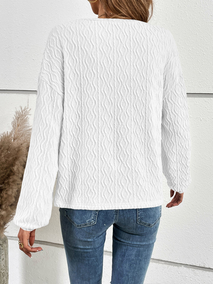 Textured half-button henley top with long sleeves