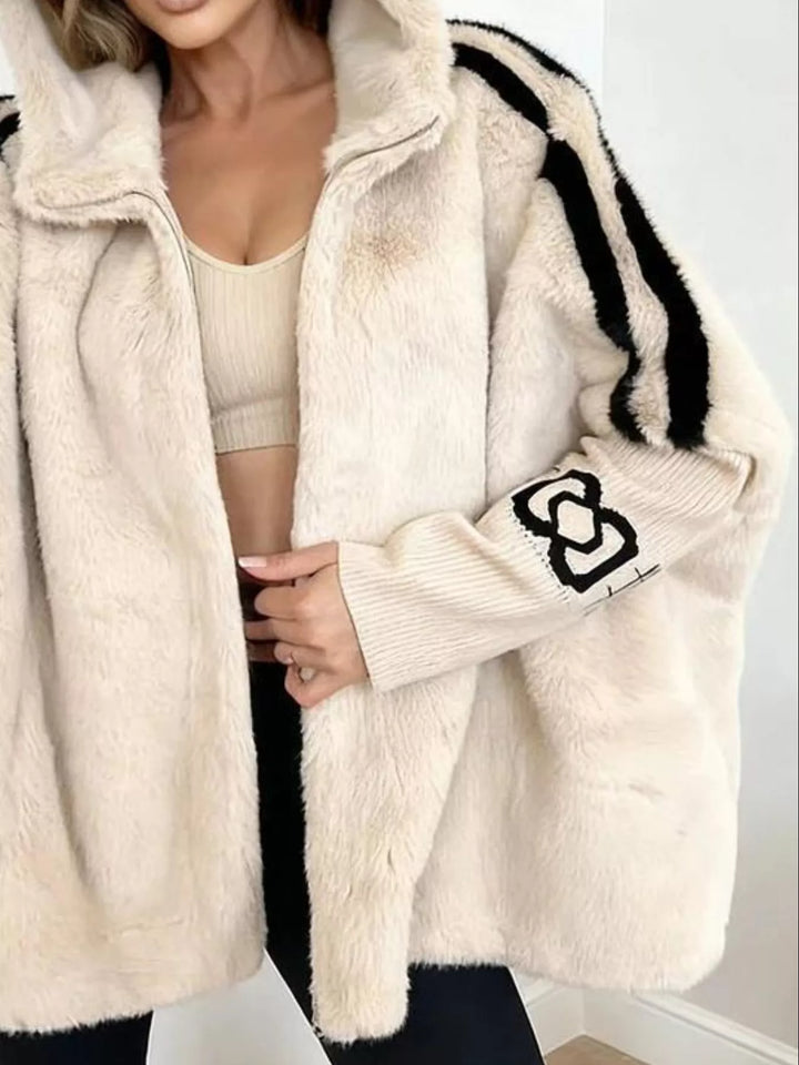 Hooded faux fur coat with striped trim and knit sleeves