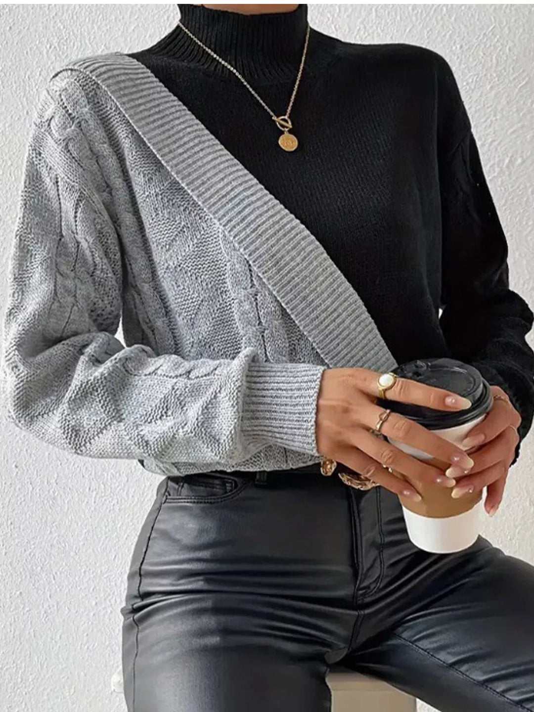 Diagonal color block cable knit mock neck sweater