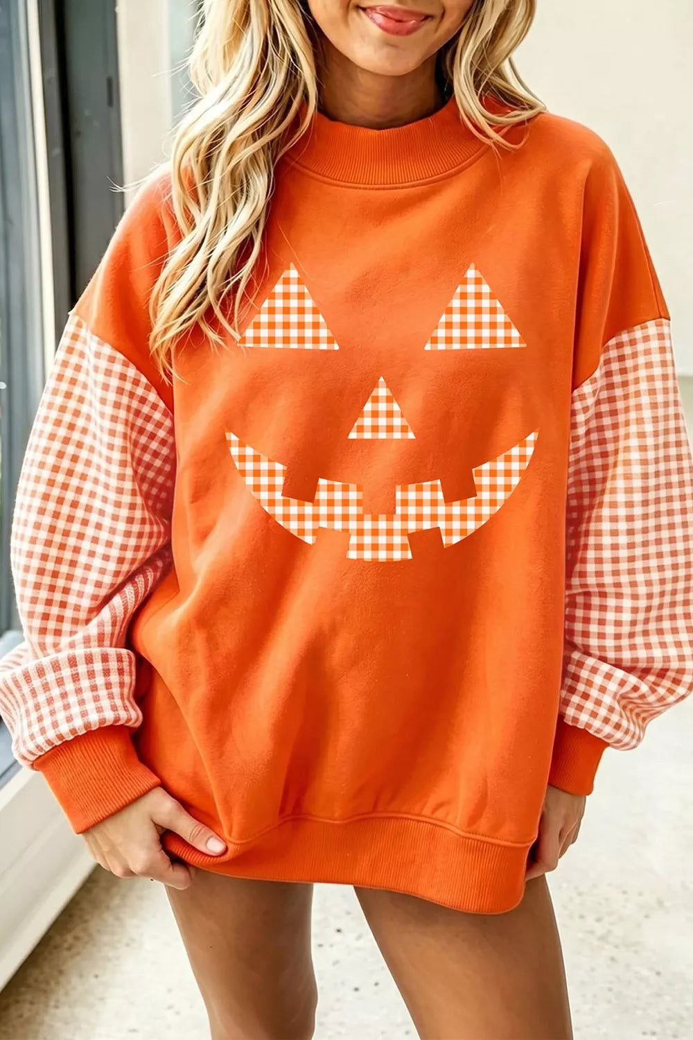 Orange Gingham sleeve pumpkin face graphic sweatshirt