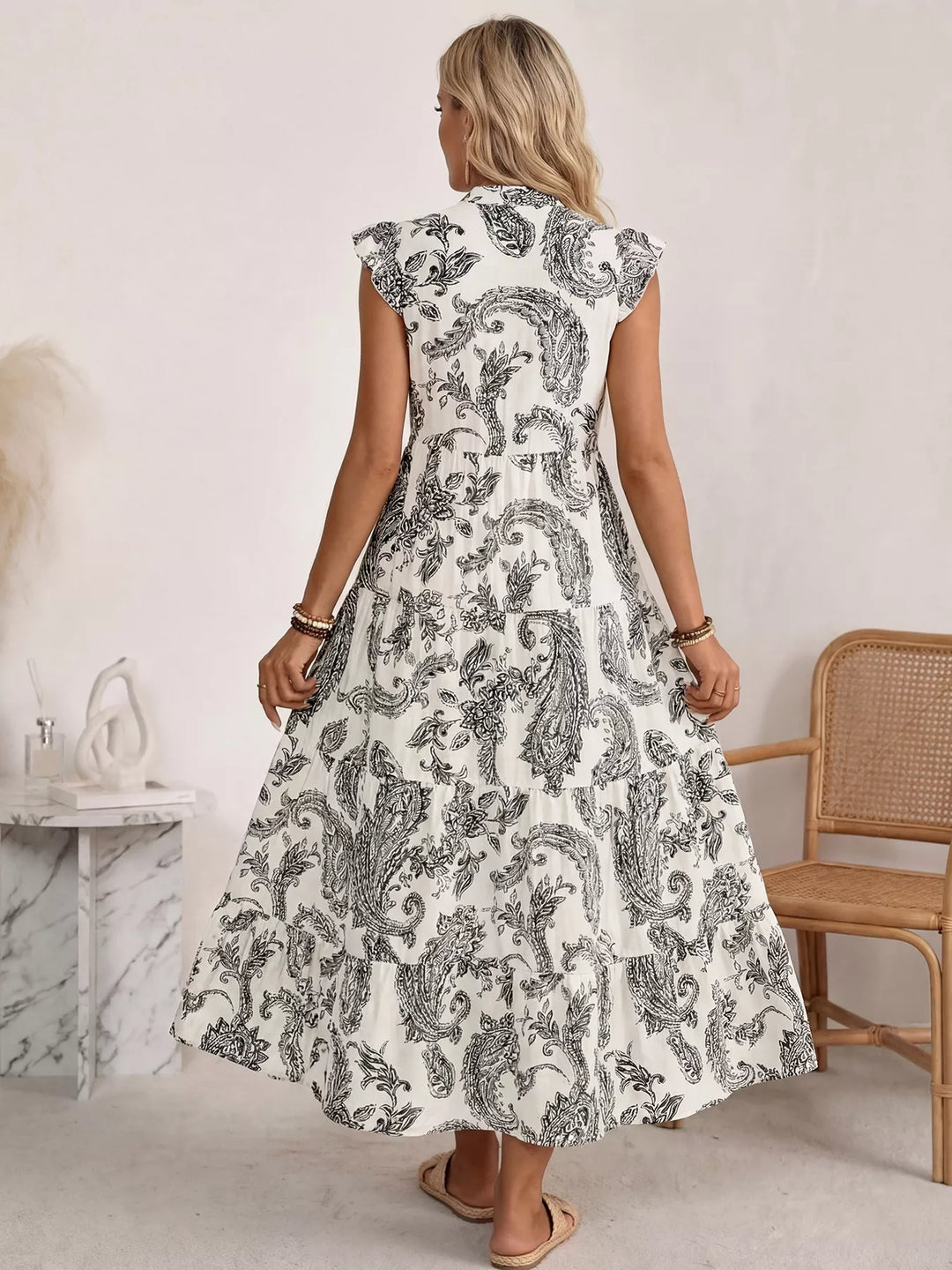 Notched neckline paisley tiered maxi dress with flutter sleeves
