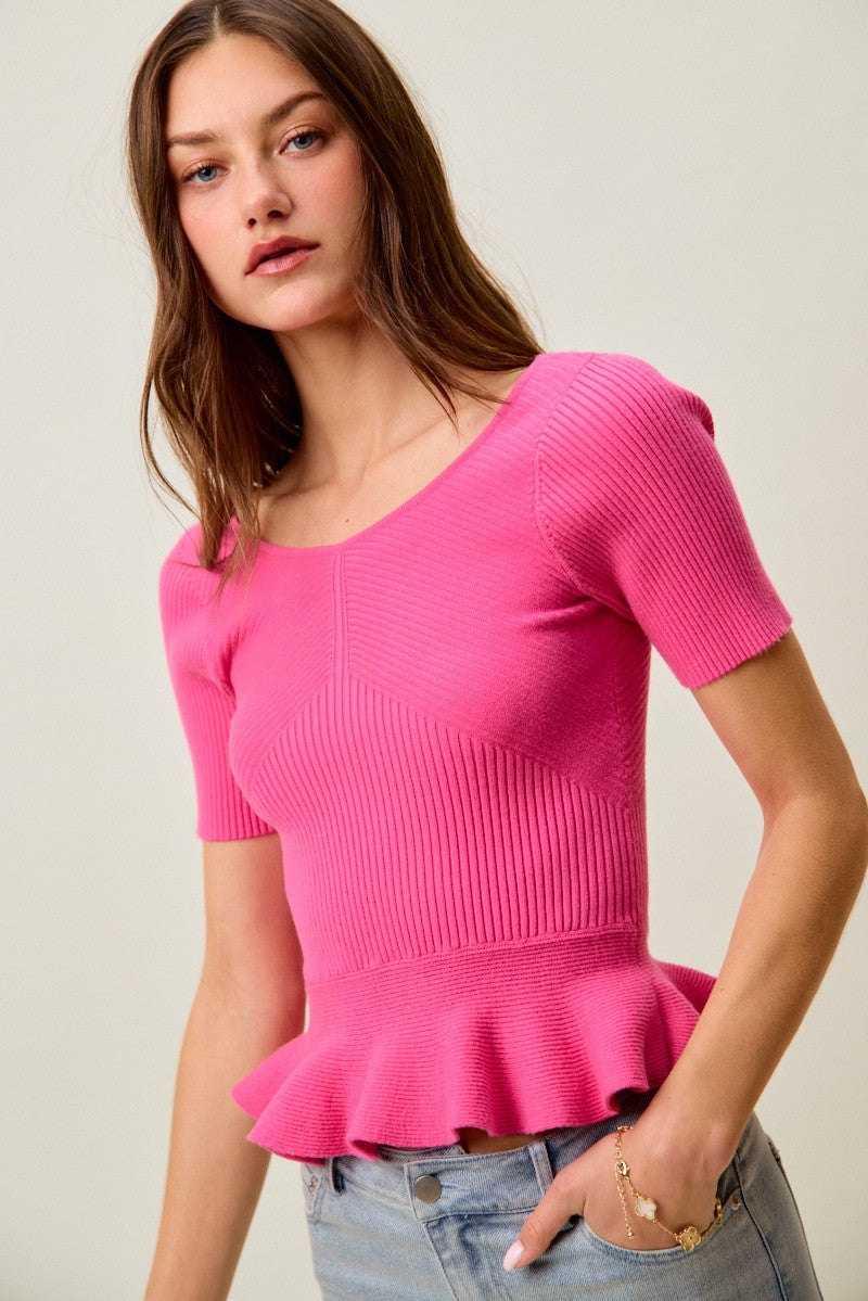 Ribbed knit peplum top with short sleeves and scoop neck