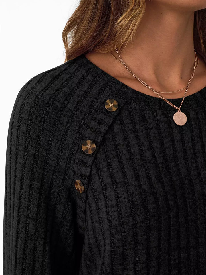 Ribbed knit long sleeve top with decorative shoulder buttons