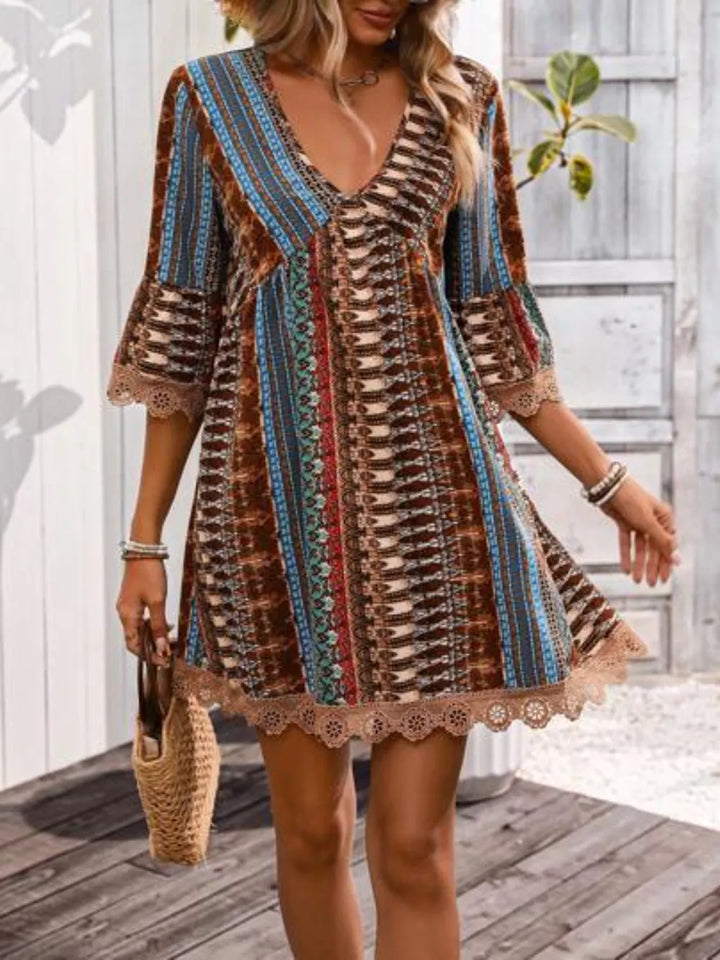 Boho printed mini dress with lace trim and bell sleeves