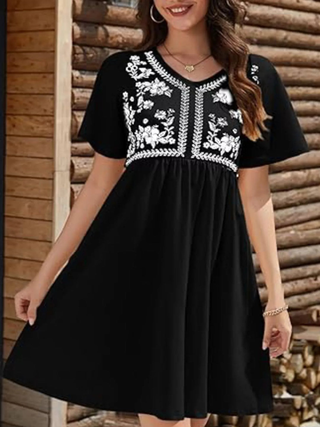 Floral embroidered v-neck babydoll mini dress