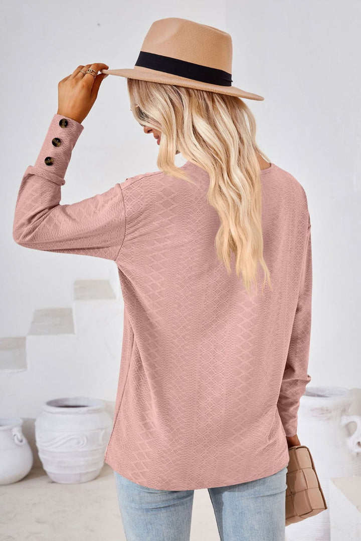 Textured knit V-neck long sleeve top with button cuffs