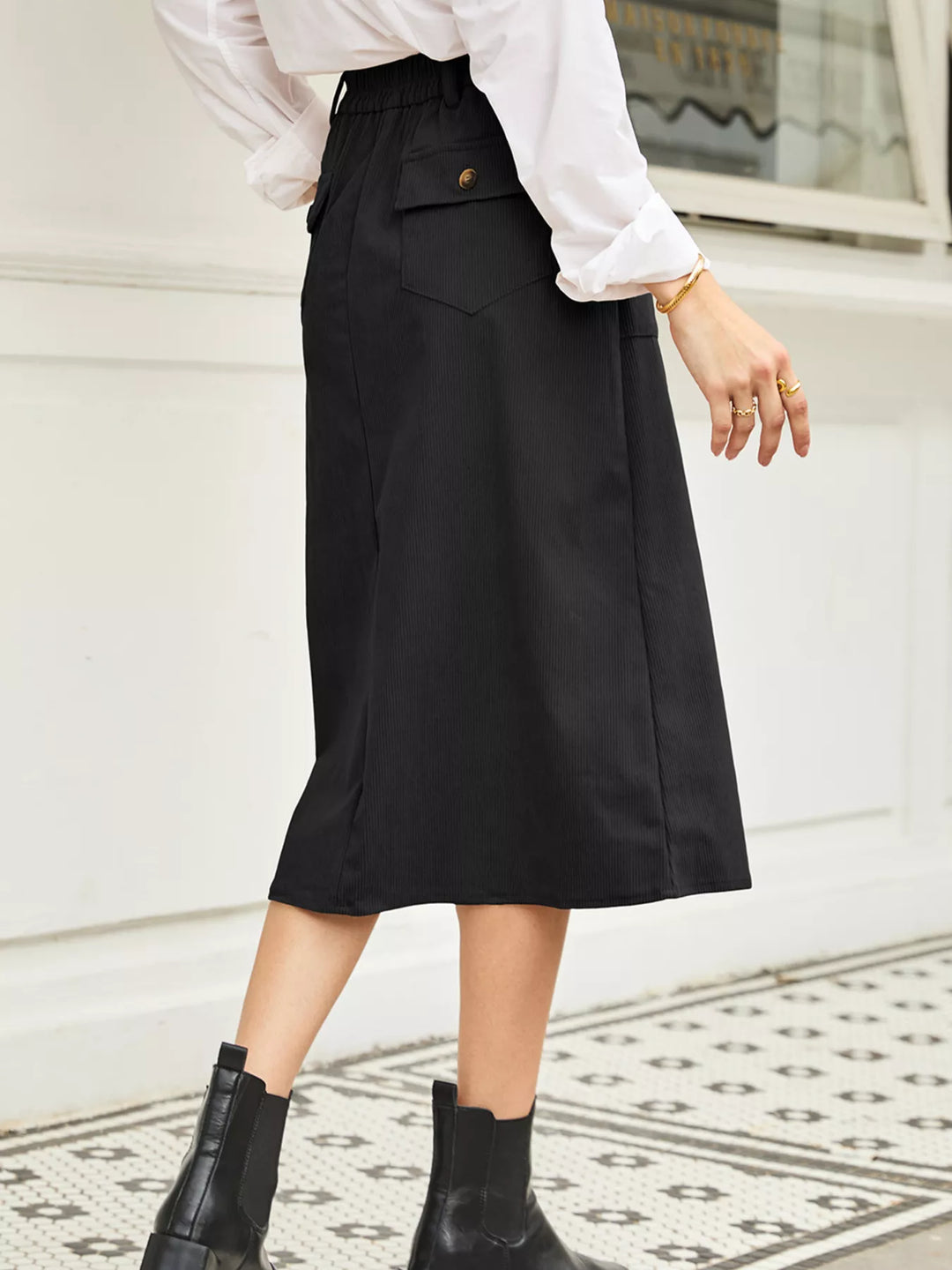 Ribbed high-waist midi skirt with front slit and pockets
