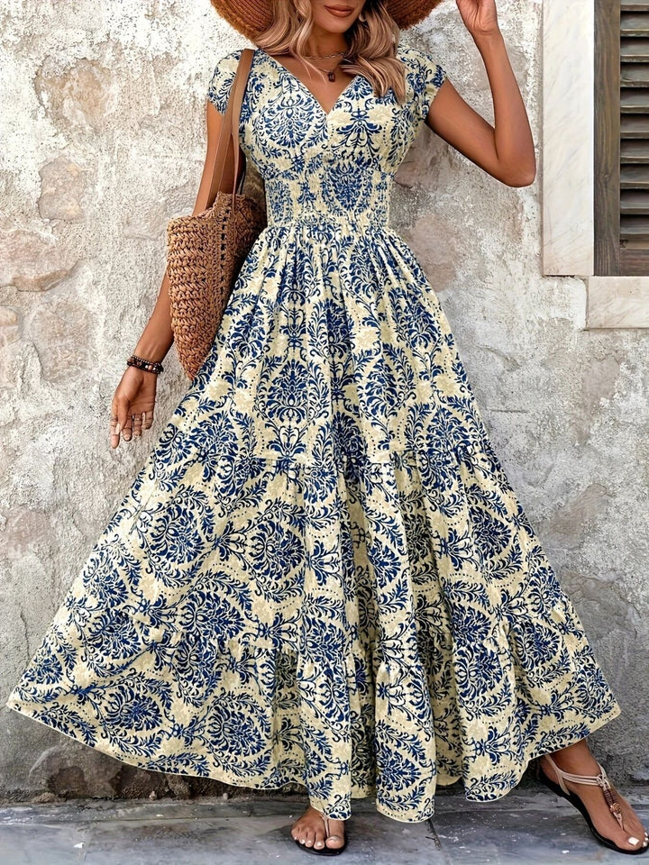 Smocked tiered maxi dress with cap sleeves and side slit