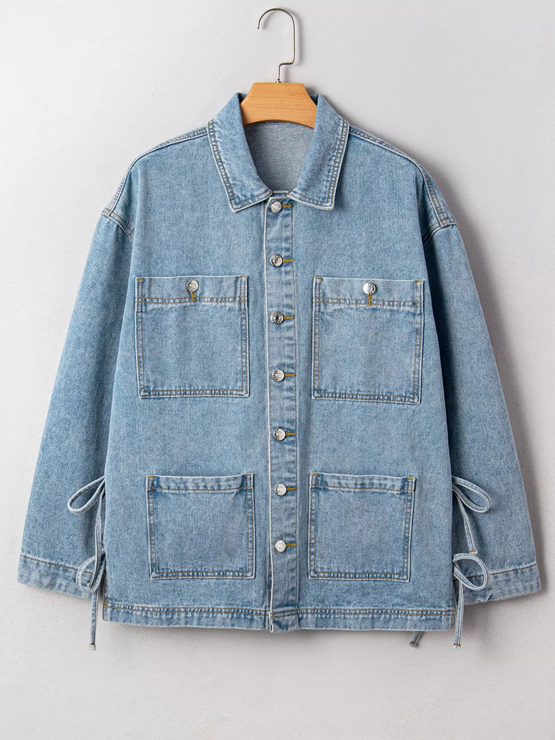 Oversized denim jacket with patch pockets and side ties