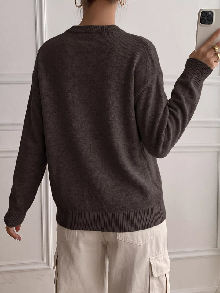 Three-button henley placket knit sweater with ribbed trim