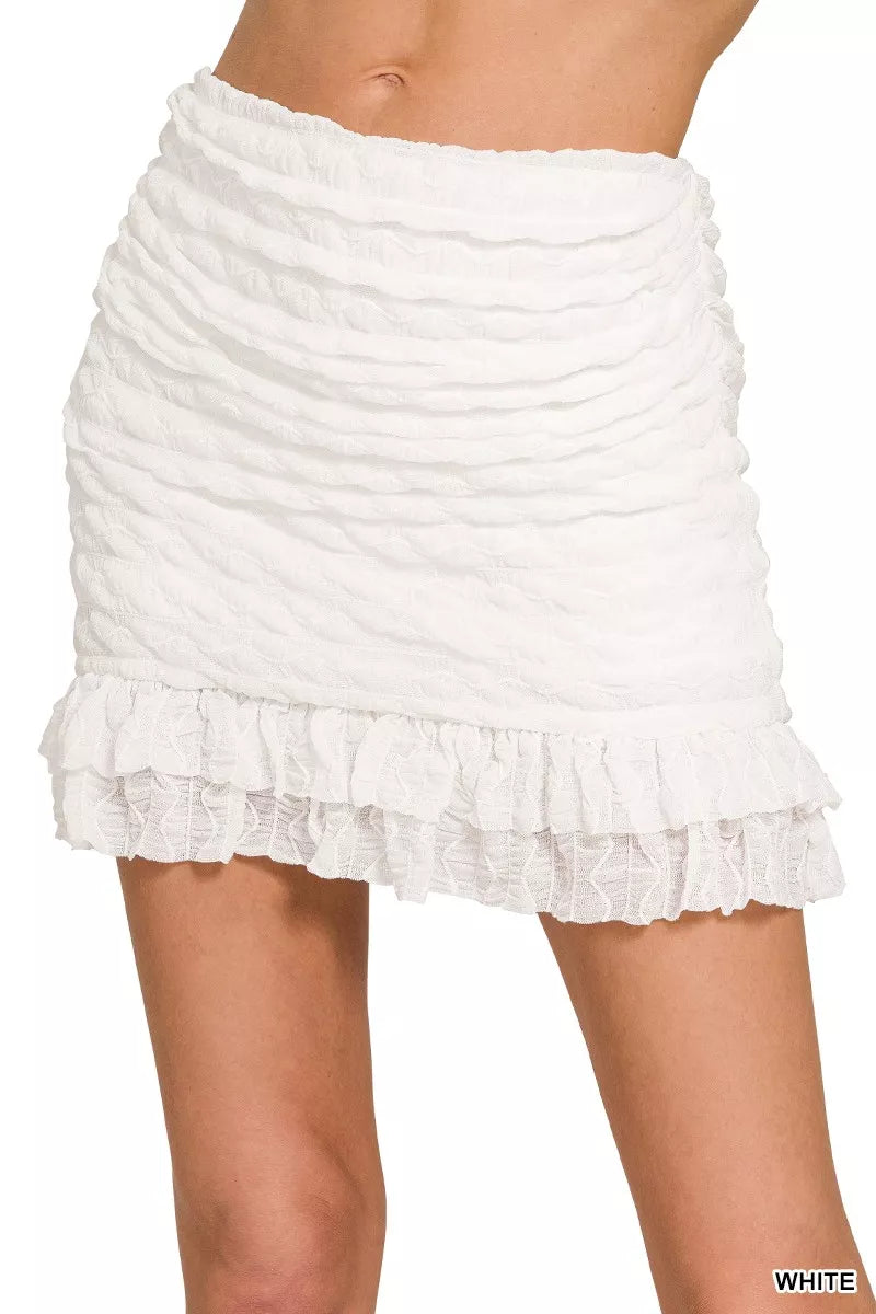 Ruched mini skirt with built-in shorts and ruffle hem