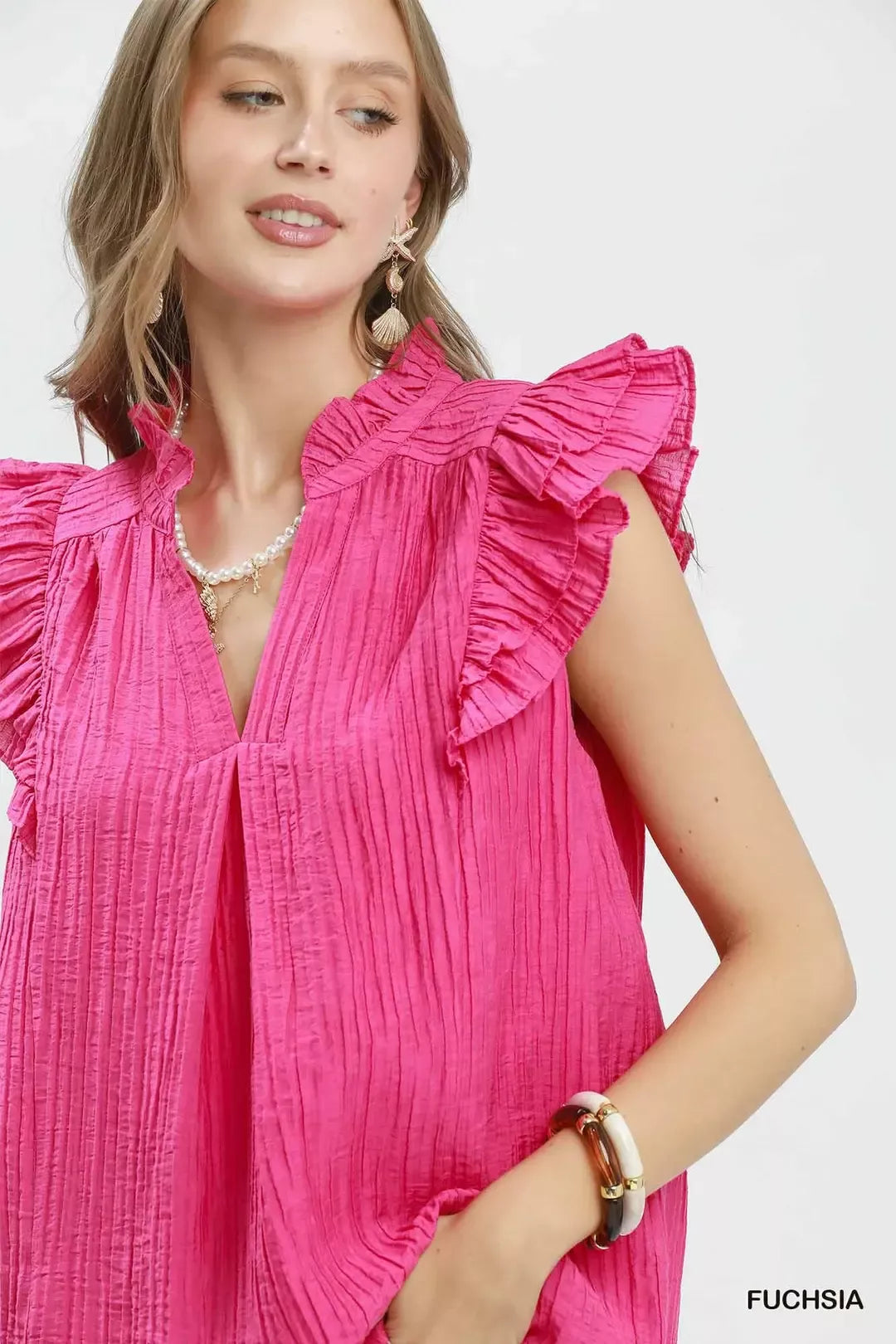 Textured split V-neck blouse with ruffle cap sleeves