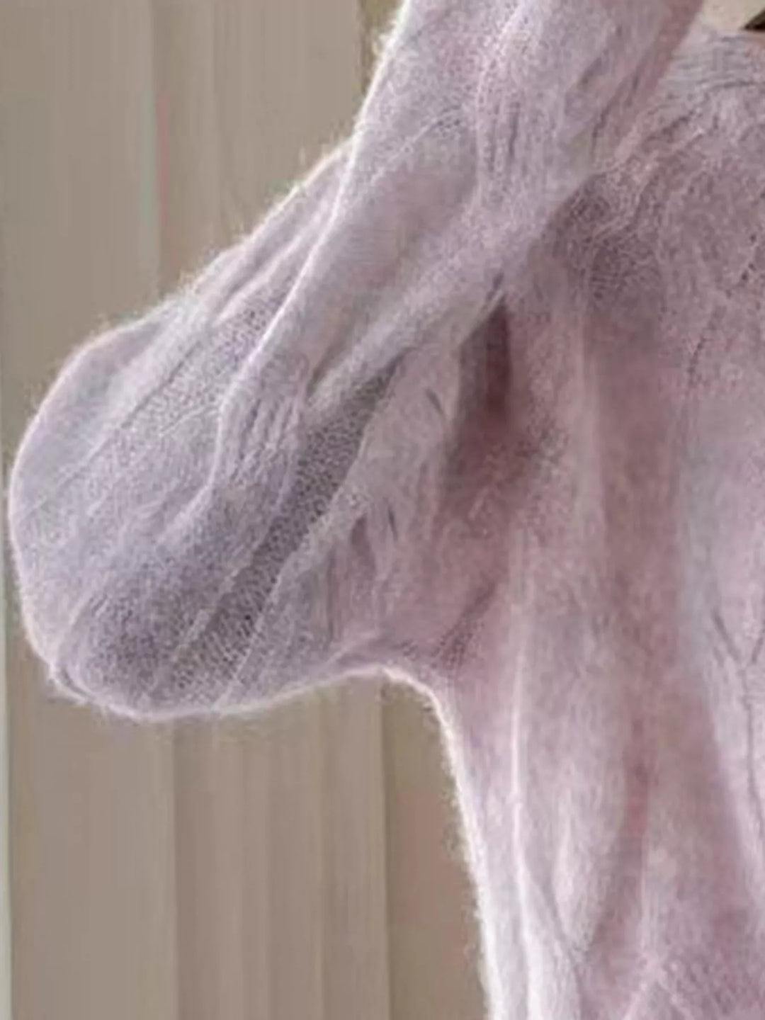 Cable-knit round neck pullover with ribbed cuffs and hem