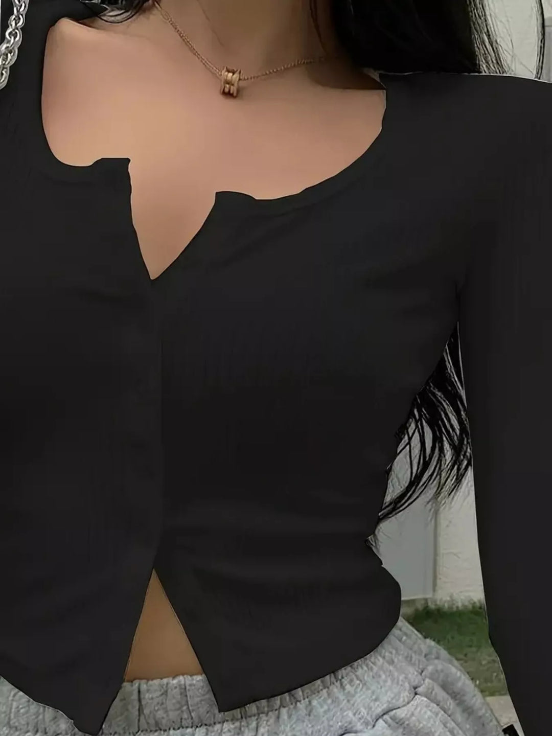 Ribbed knit button-front long sleeve top