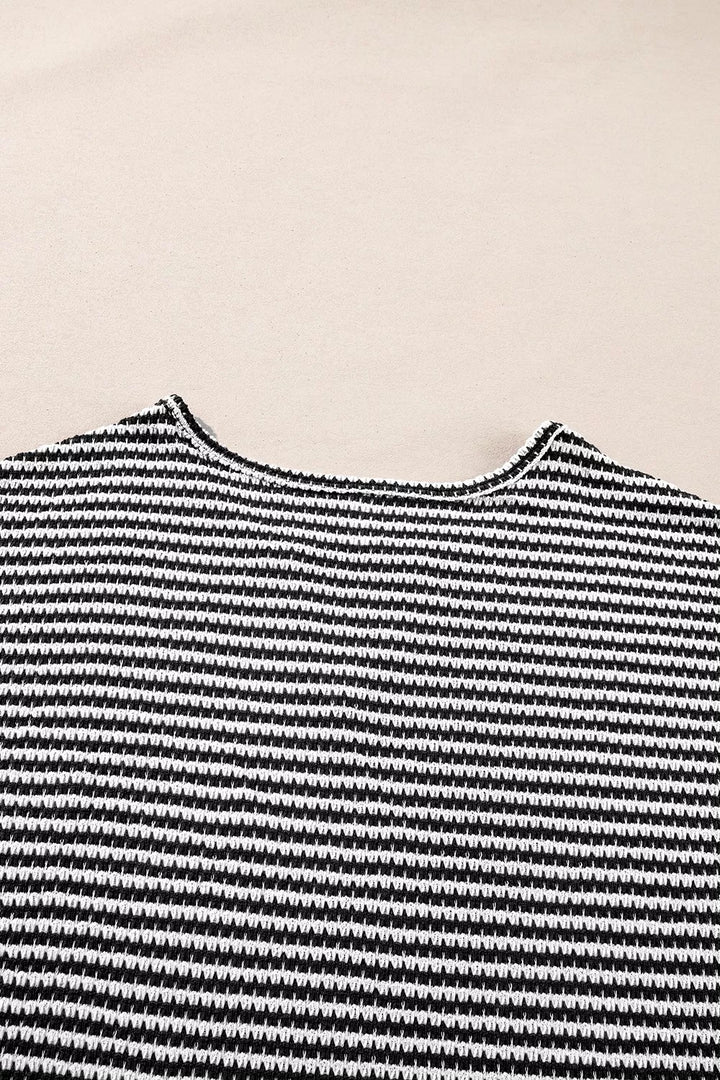Striped textured knit top with notched V-neck and cuffed sleeves