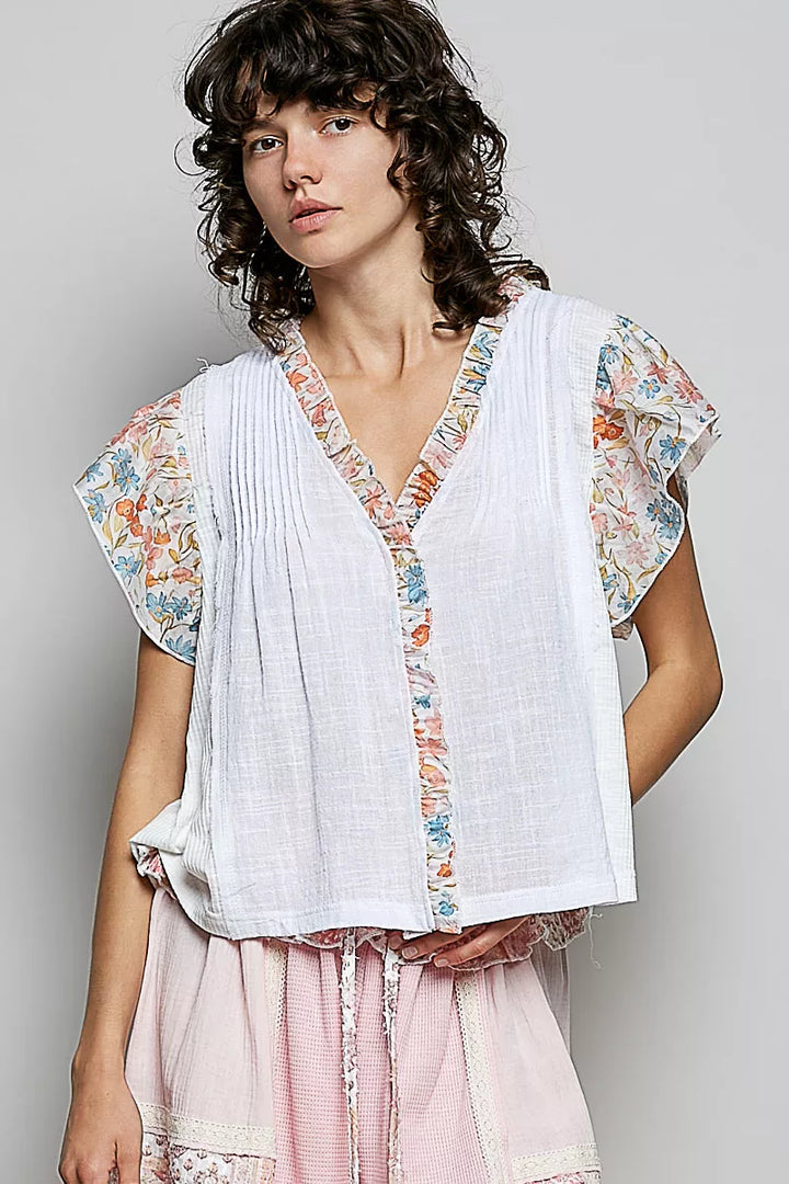 IVORY V-neck woven cotton blouse with floral ruffle cap sleeves