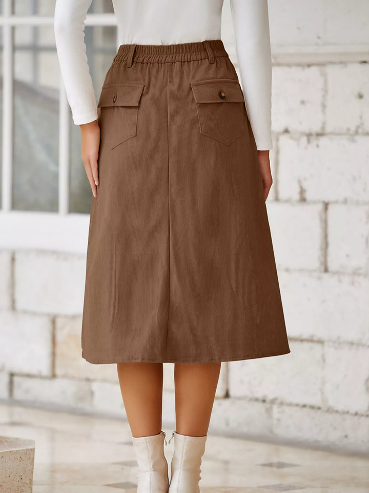 Ribbed high-waist midi skirt with front slit and pockets
