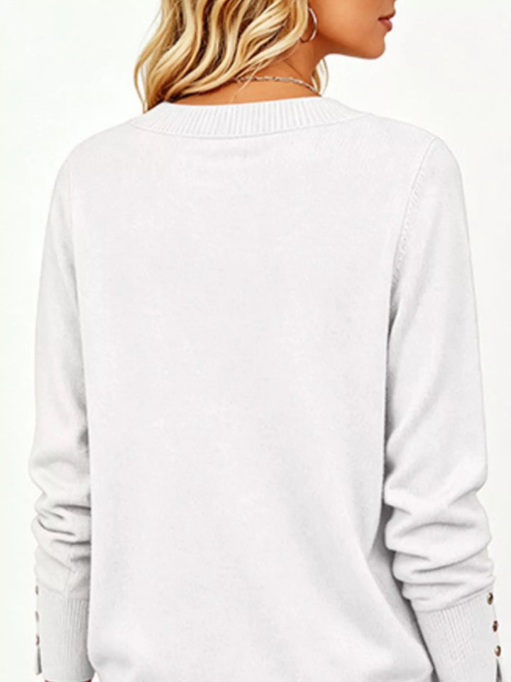 V-neck long sleeve sweater with button cuffs and side slits