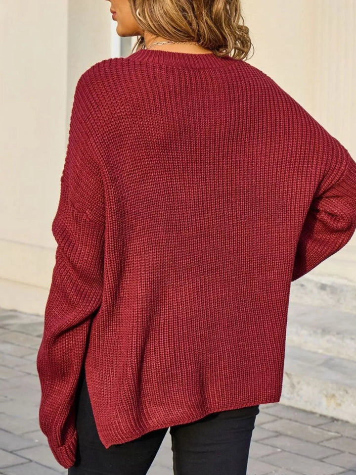 Ribbed knit sweater with chest pockets and button cuffs