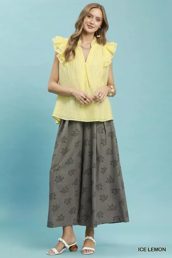 Textured split V-neck top with ruffle cap sleeves