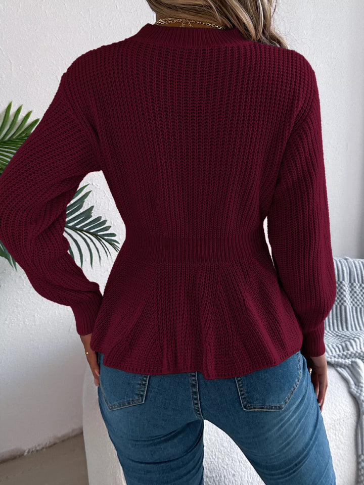 Cable knit peplum sweater with mock neck