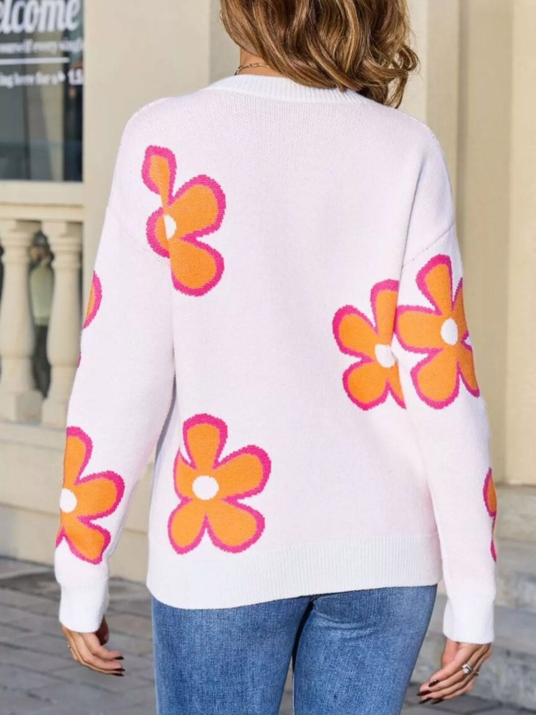 Floral crew neck knit sweater with ribbed cuffs