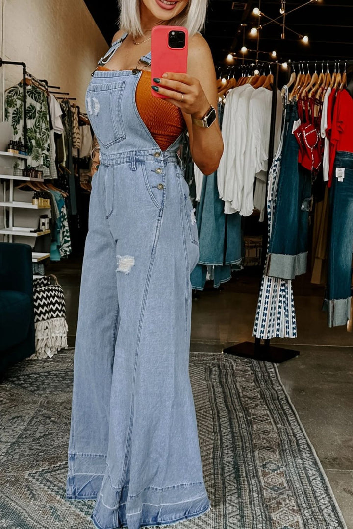 Distressed wide-leg denim overalls with adjustable straps