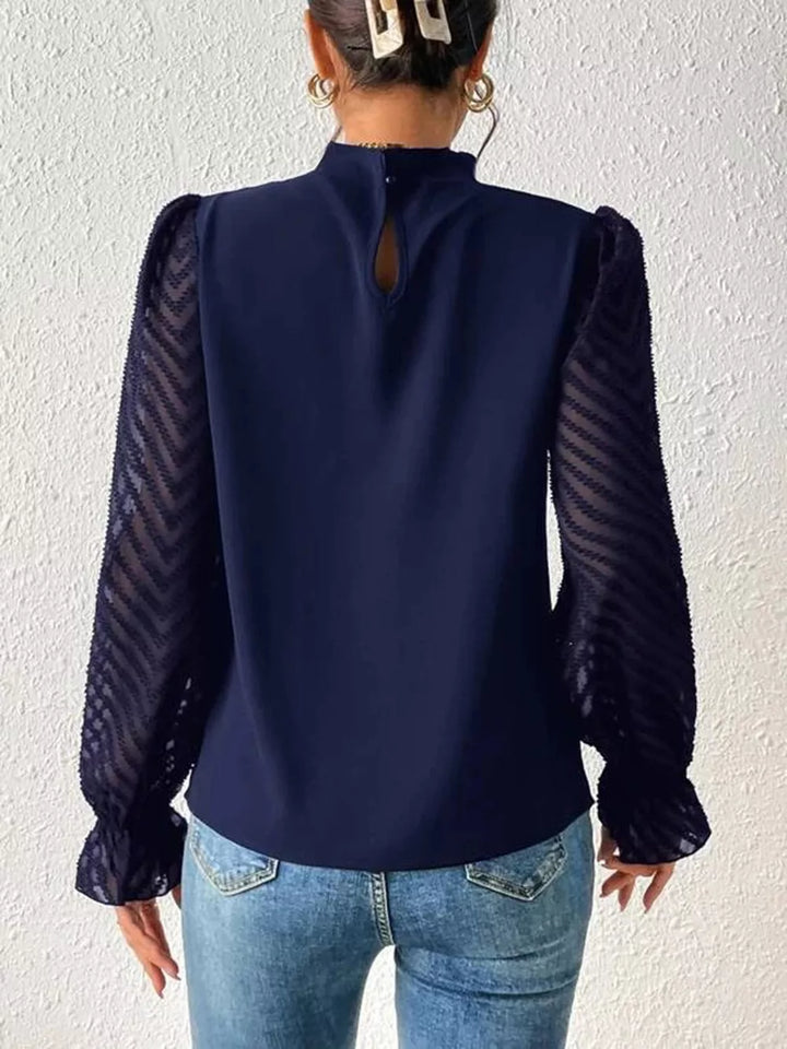 Mock neck blouse with sheer textured flounce sleeves